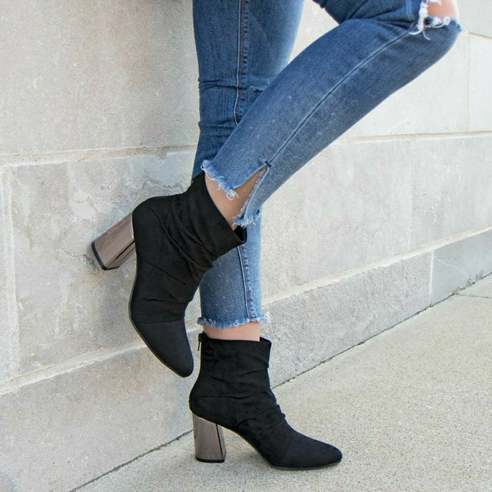 Black suede booties with silver heels